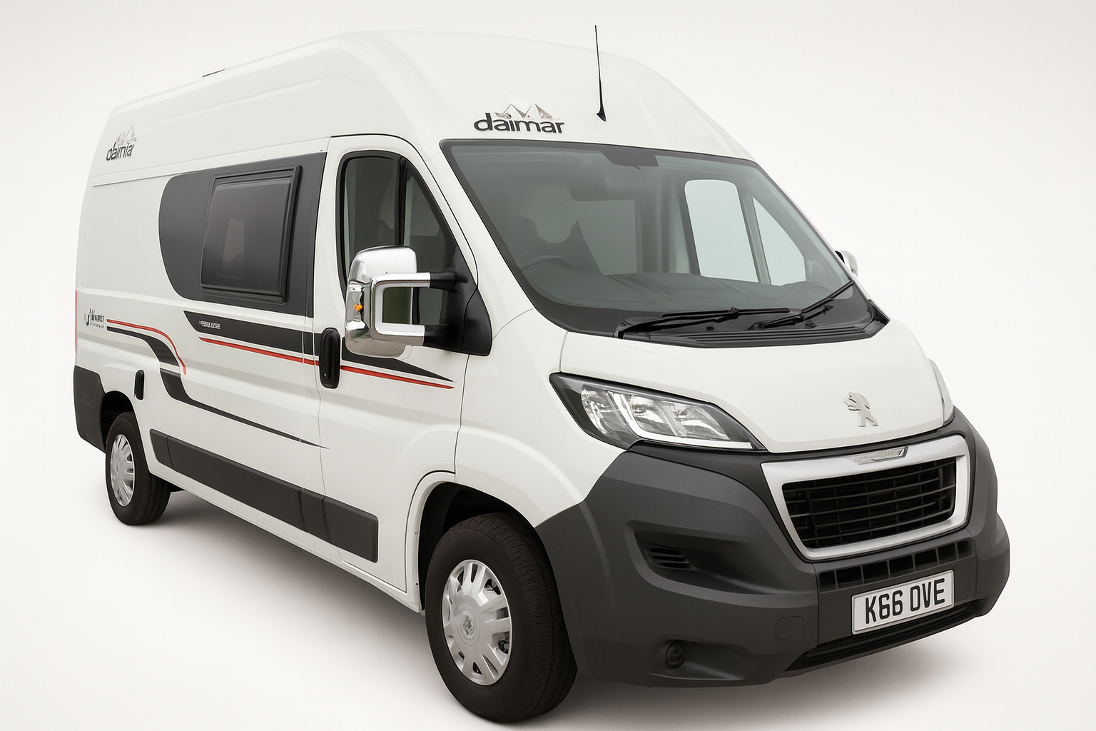 White Peugeot-based Daimar campervan, side view